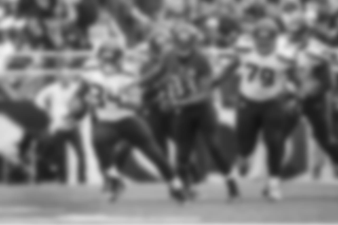 Running back Thomas Rawls takes off through a hole in the right side created in part by Garry Gilliam (79) and Patrick Lewis (65) during the first quarter. Rawls rushed for 44 yards on six carries before leaving with an injury.