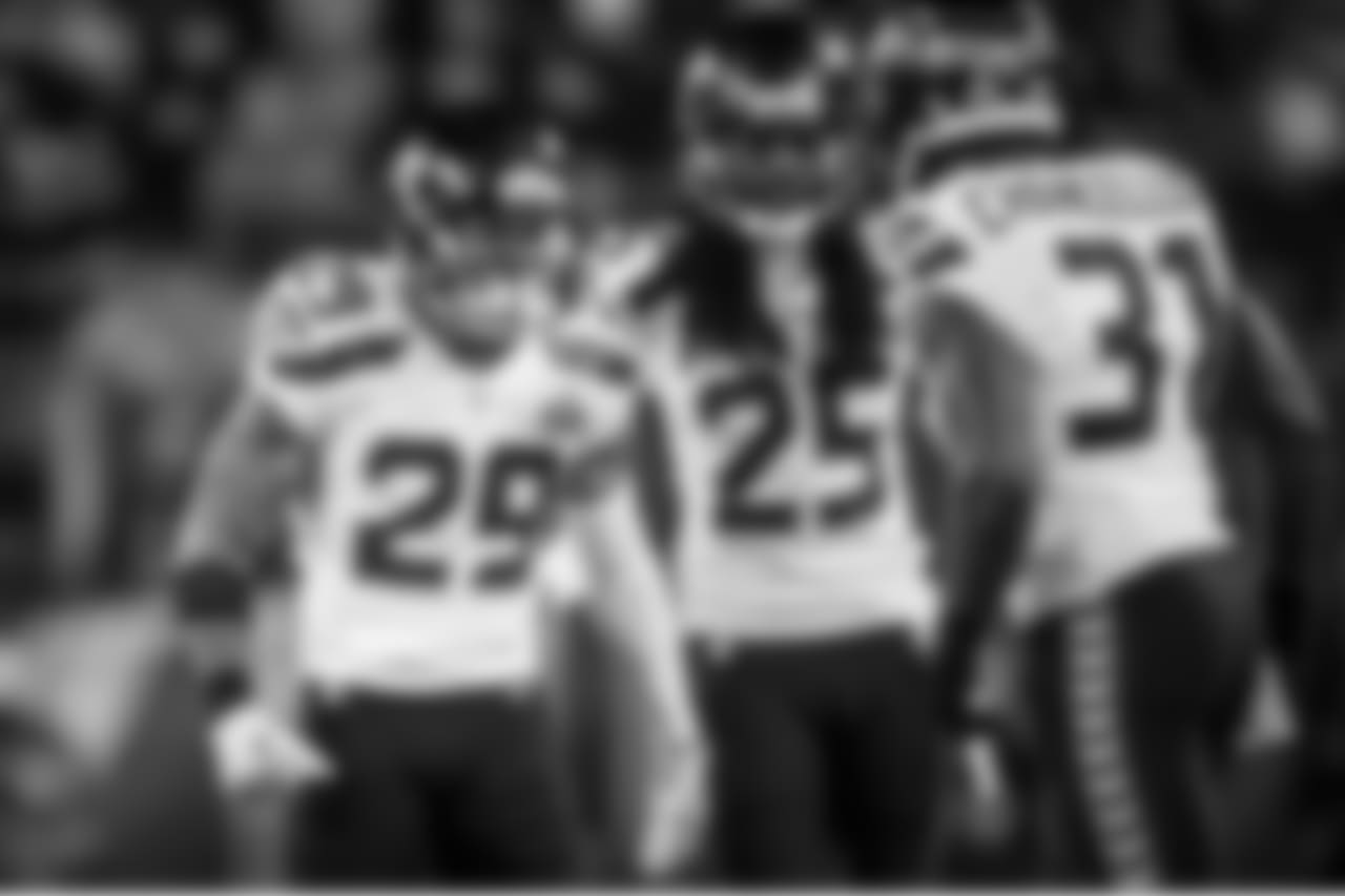 Safety Earl Thomas and cornerback Richard Sherman are fired up after Kam Chancellor's big hit on Denver's Demaryius Thomas.
