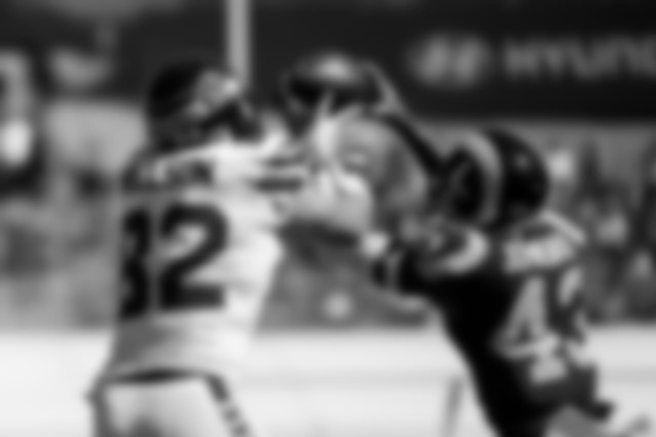 Seattle's Luke Willson can't prevent Rams defensive back John Johnson III from intercepting a pass thrown by Russell Wilson in the second quarter.