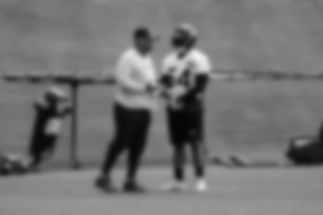 Defensive coordinator Ken Norton Jr., left, and LB Bobby Wagner