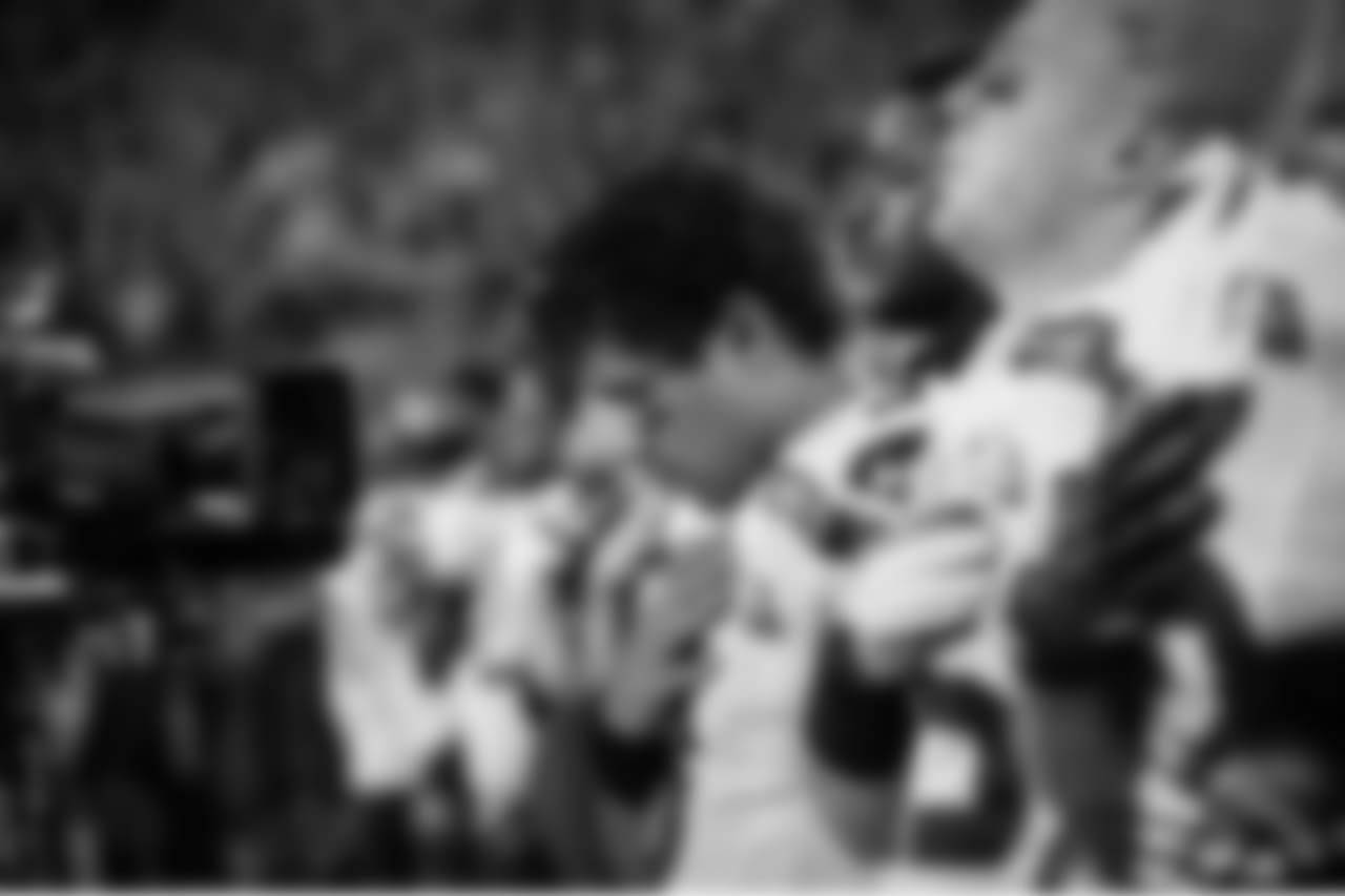 Quarterback Russell Wilson gathers his thoughts during the national anthem as a network television camera rests just inches from his face.