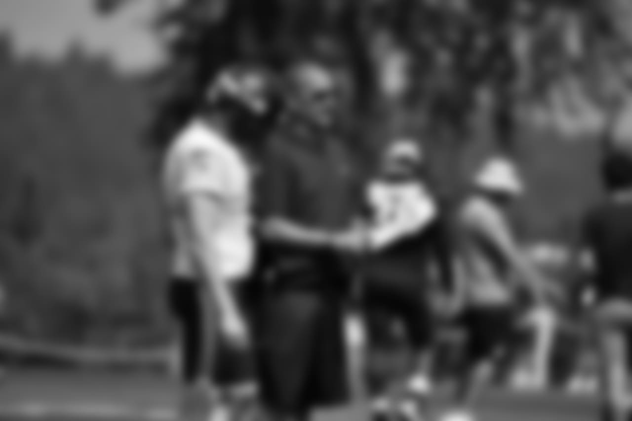 P Jon Ryan, left, and special teams coordinator Brian Schneider, right