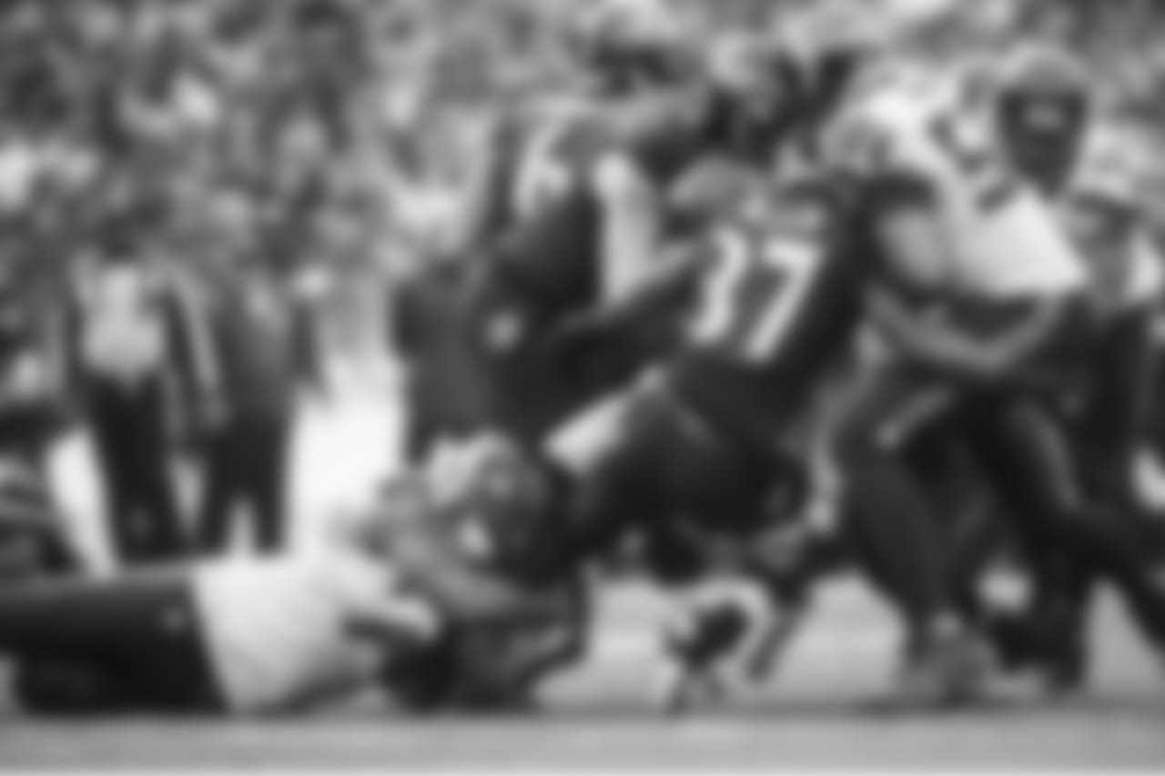 Michael Bennett doesn't let go of Baltimore's Javorius Allen and K.J. Wright finished the tackle.
