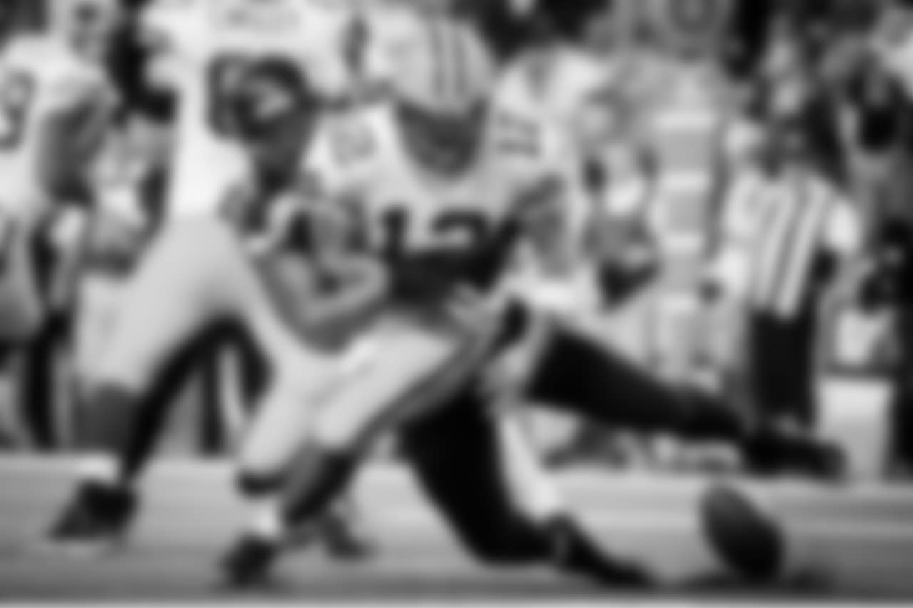 Seattle's Michael Bennett gets a strip sack as he knocks the ball out of the hands of Green Bay quarterback Aaron Rodgers that resulted in a safety.