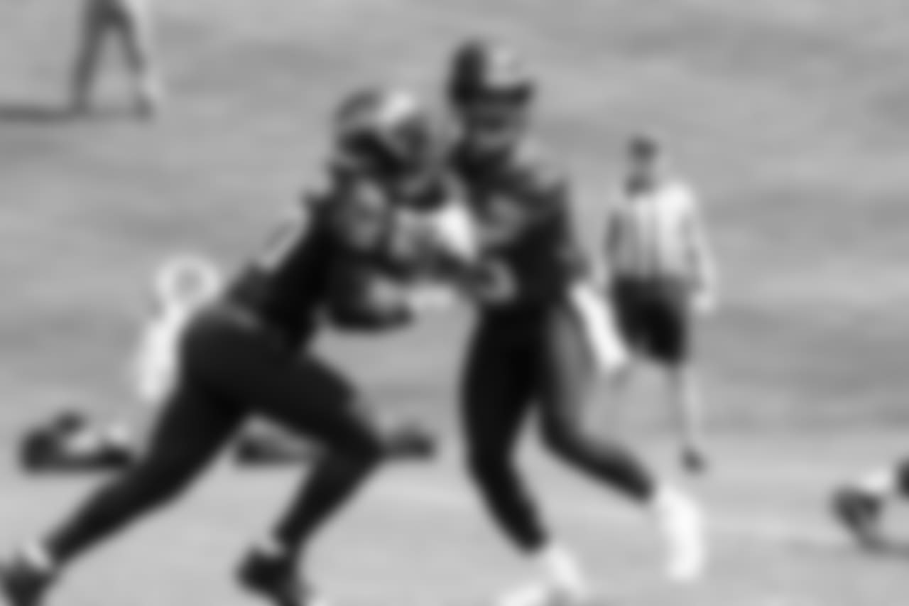 QB Russell Wilson, right, and RB Rashaad Penny, left
