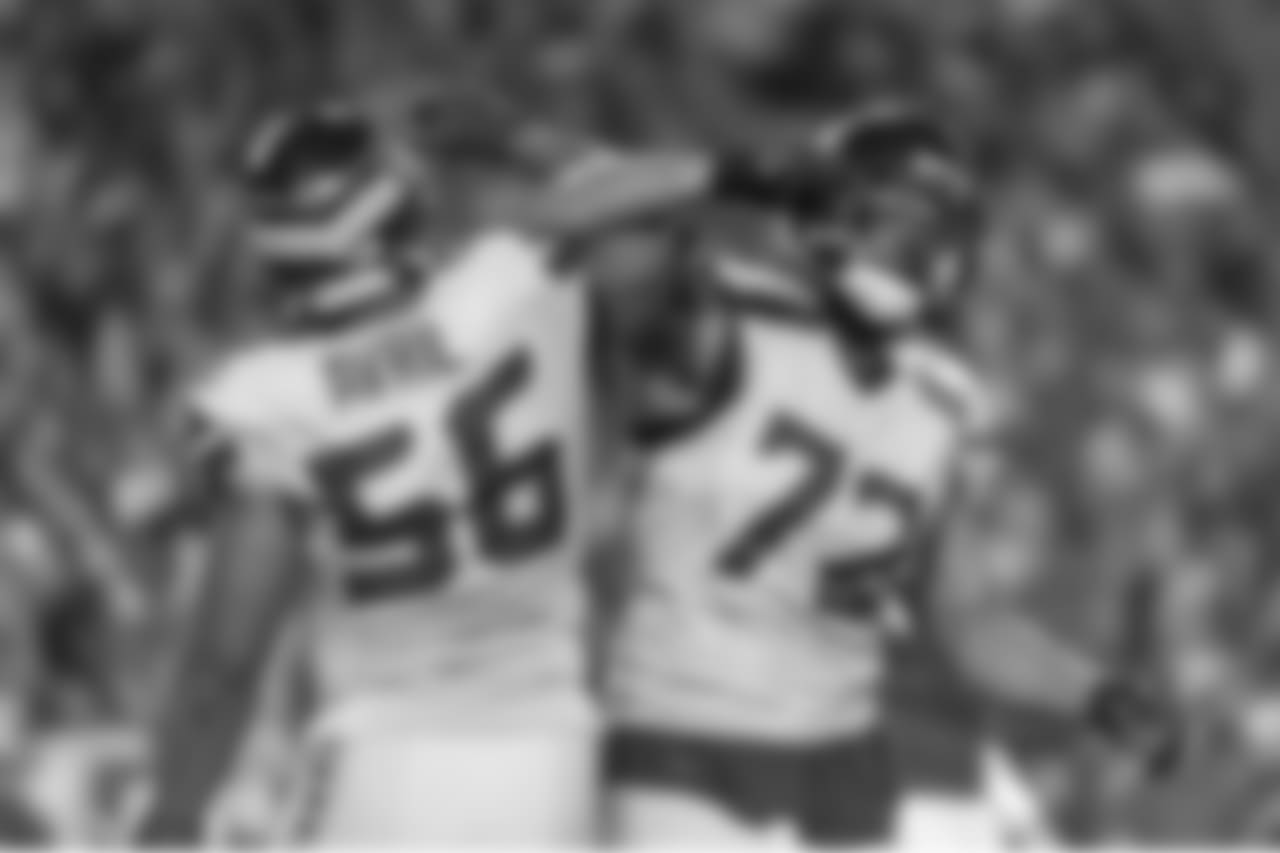 Seahawks Cliff Avril and Michael Bennett celebrate after another stop by the Seahawks defense.