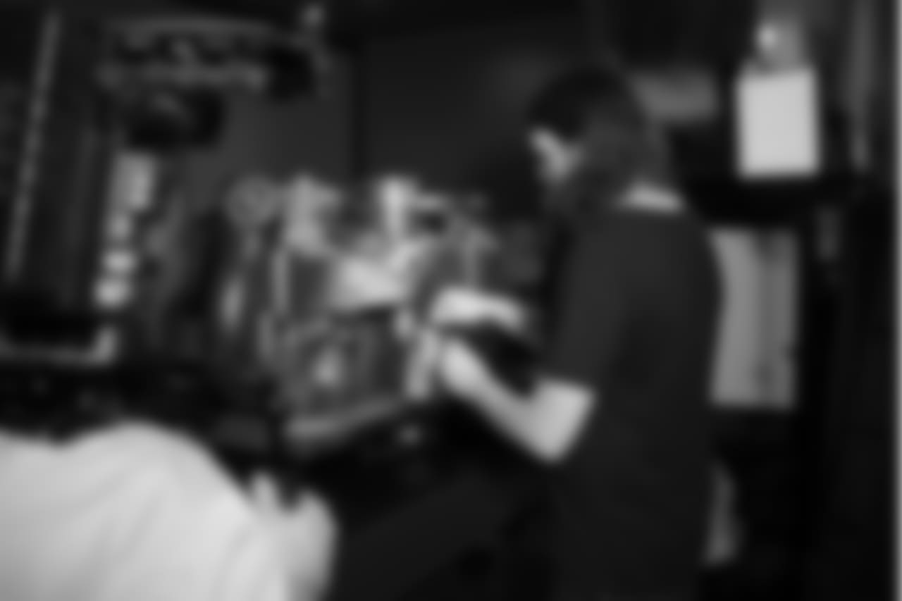 Latte artist Kale Lotton works on the Seahawks schedule release video.