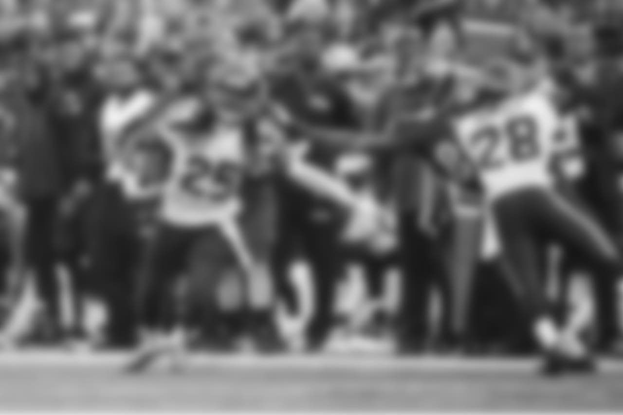 Richard Sherman attempts to head upfield after intercepting a pass intended for Ravens receiver and former Seahawk Chris Matthews, but Matthew grabs him by the hair and doesn't let go.