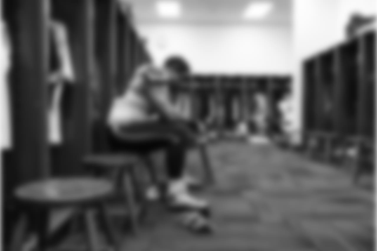 Offensive tackle Garry Gilliam sits alone at his locker before taking the field to face the Ravens.