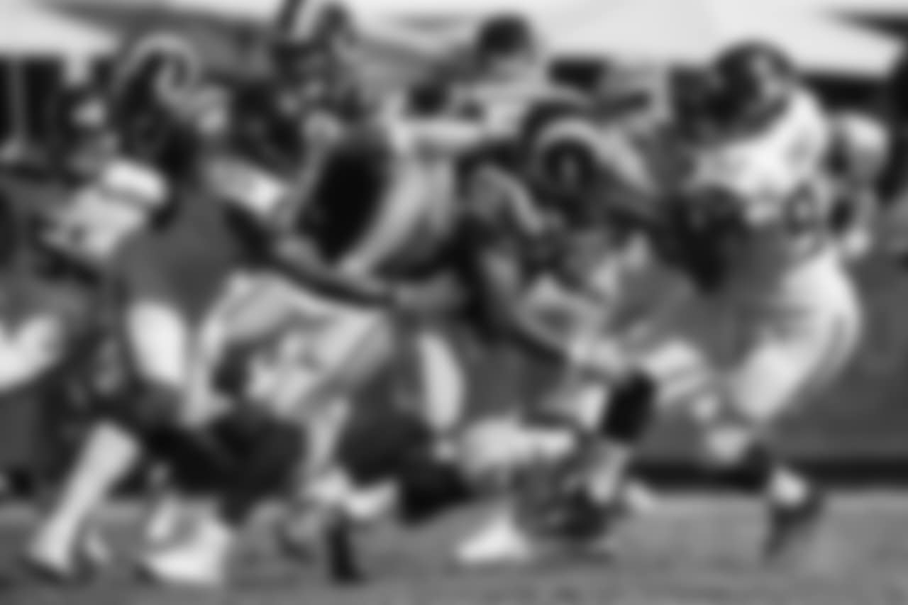 Seattle's Frank Clark collars Rams running back Todd Gurley.