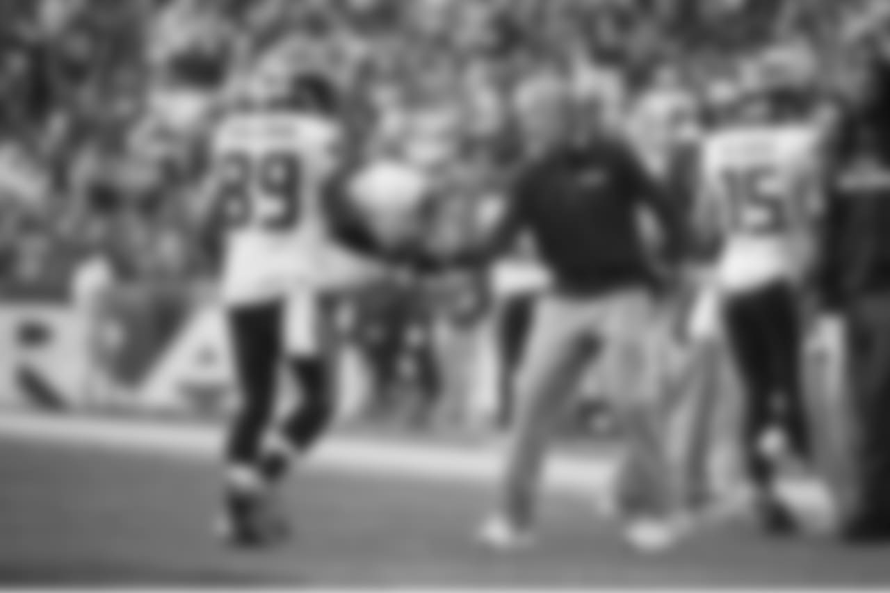 Head coach Pete Carroll congratulates receiver Doug Baldwin after the first of Baldwin's three touchdowns on the day.