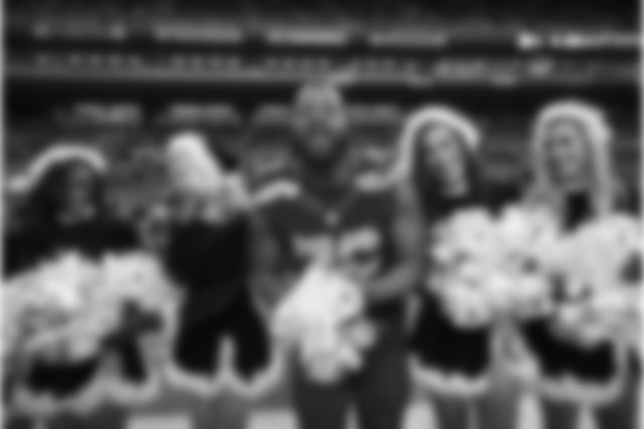Michael Bennett, who often refers to himself as "Black Santa", got into the holiday spirit with the Sea Gals after the game.