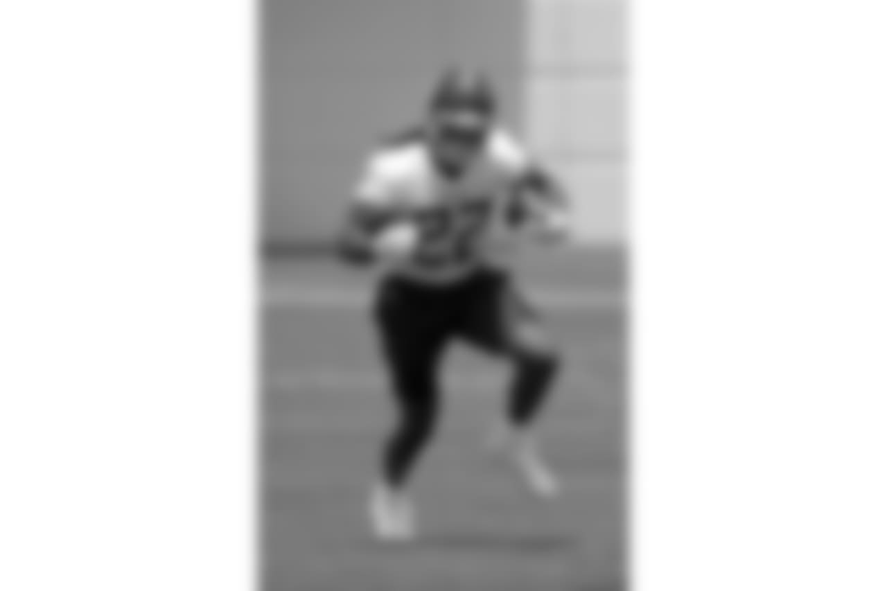 Tennessee Titans running back Derrick Henry (22) runs a drill during NFL football minicamp Tuesday, June 12, 2018, in Nashville, Tenn. (AP Photo/Mark Humphrey)
