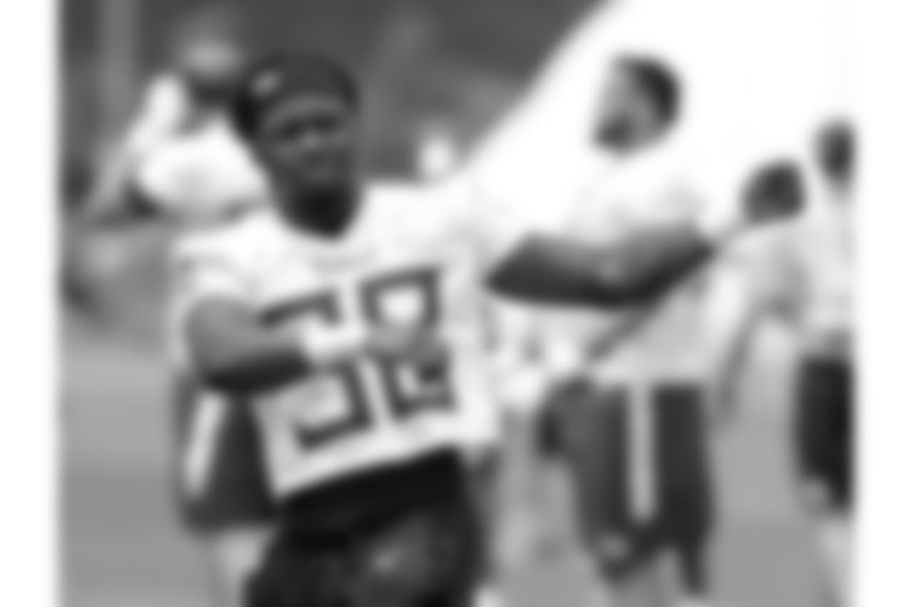 Tennessee Titans running back Akrum Wadley stretches during an organized team activity at the Titans' NFL football training facility Wednesday, May 30, 2018, in Nashville, Tenn. (AP Photo/Mark Humphrey)