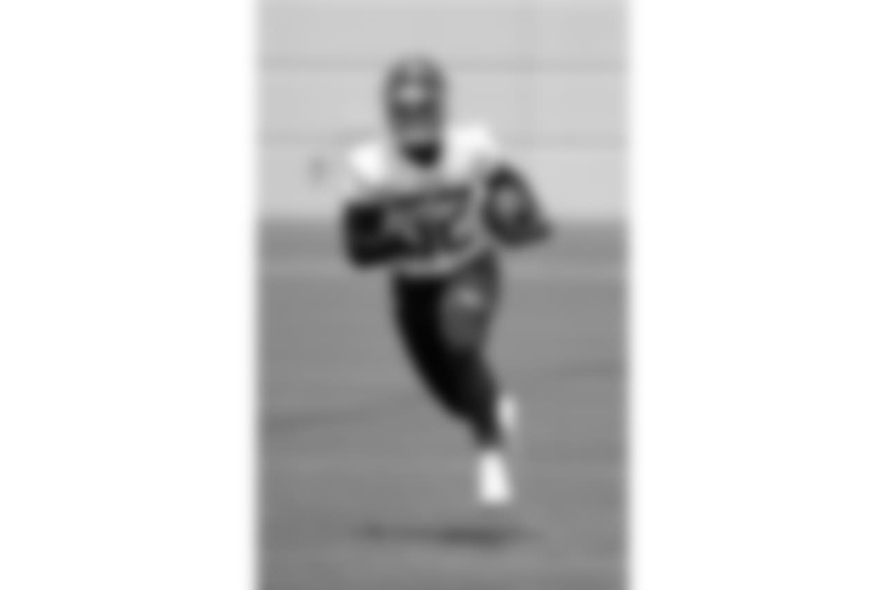 Tennessee Titans running back David Fluellen runs a drill during NFL football minicamp Tuesday, June 12, 2018, in Nashville, Tenn. (AP Photo/Mark Humphrey)