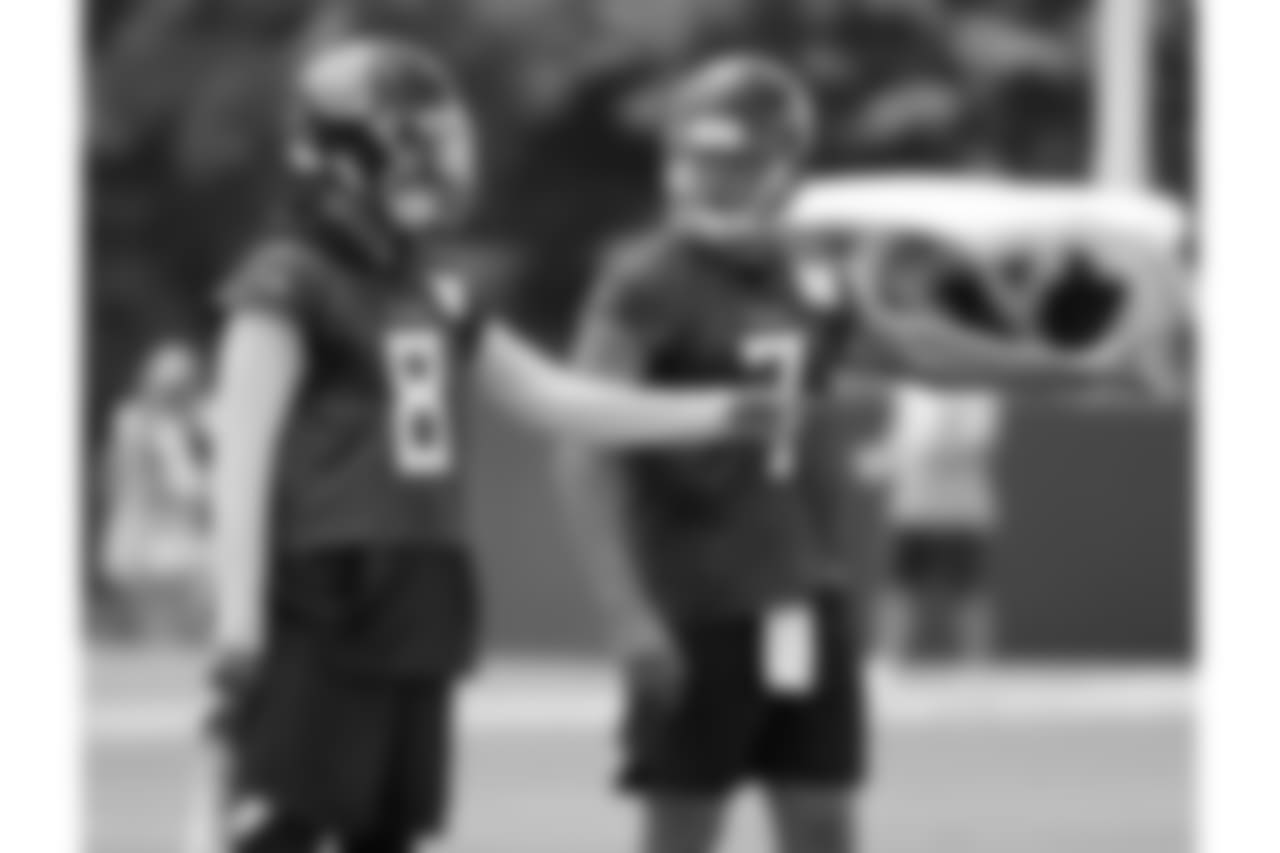Tennessee Titans quarterbacks Marcus Mariota (8) and Blaine Gabbert (7) get set to run a drill during an organized team activity at the Titans' NFL football training facility Tuesday, May 22, 2018, in Nashville, Tenn. (AP Photo/Mark Humphrey)