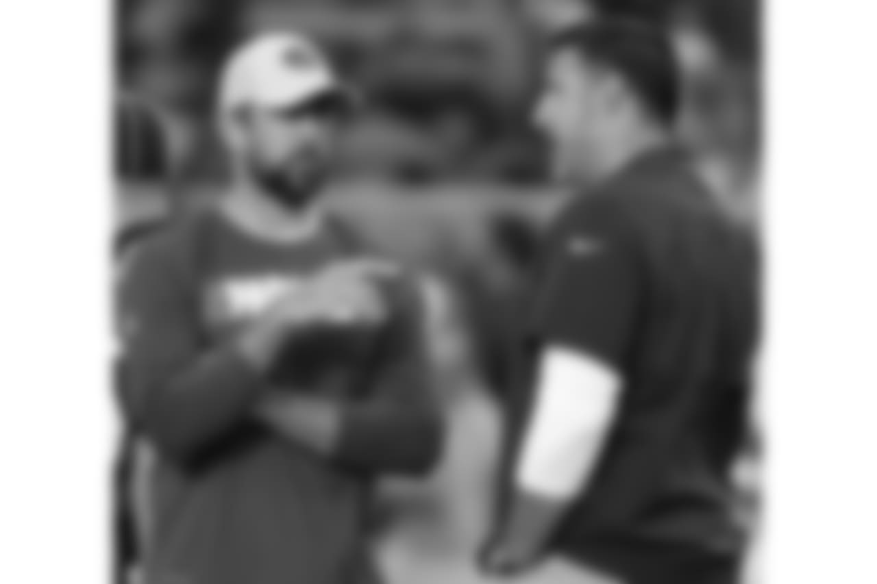 Green Bay Packers' Aaron Rodgers talks to Tennessee Titans head coach Mike Vrabel before a preseason NFL football game Thursday, Aug. 9, 2018, in Green Bay, Wis. (AP Photo/Matt Ludtke)