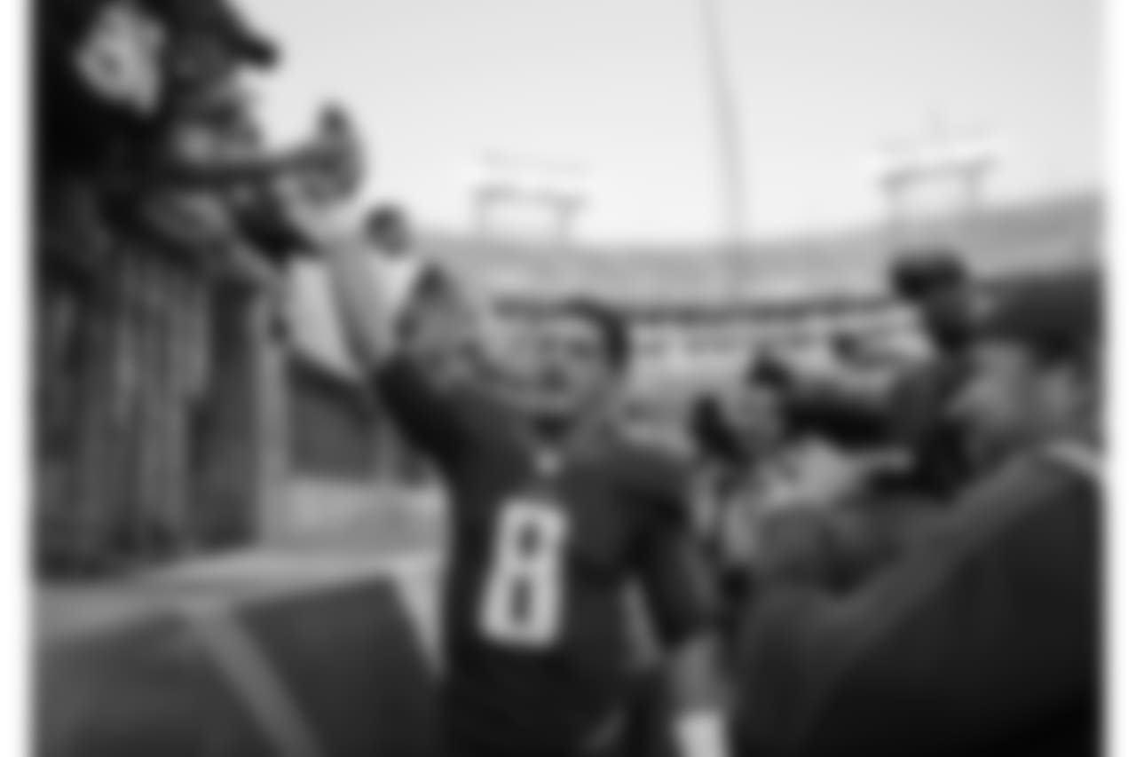 Tennessee Titans quarterback Marcus Mariota slaps hands with fans as he leaves the field after the Titans beat the Green Bay Packers 47-25 in an NFL football game Sunday, Nov. 13, 2016, in Nashville, Tenn. (AP Photo/James Kenney)