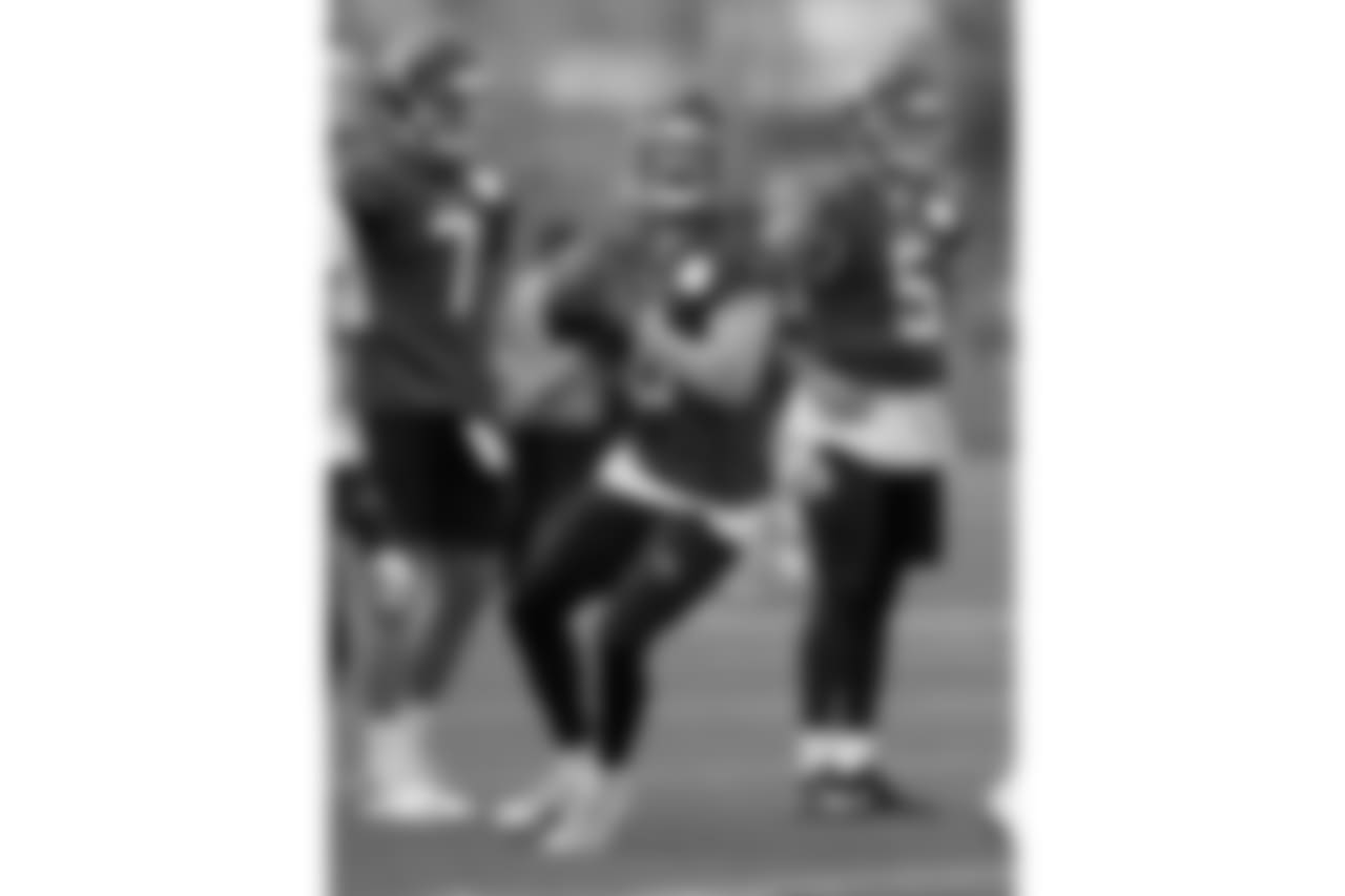 Tennessee Titans quarterbacks Blaine Gabbert (7), Marcus Mariota (8) and Tyler Ferguson (5) run a drill during the team's voluntary practice at its NFL football training facility Thursday, April 26, 2018, in Nashville, Tenn. (AP Photo/Mark Humphrey)