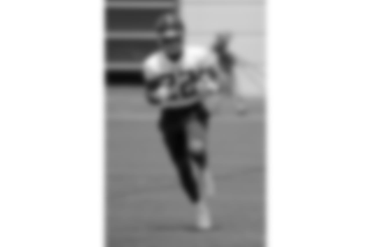 Tennessee Titans running back Derrick Henry (22) runs a drill during NFL football minicamp Tuesday, June 12, 2018, in Nashville, Tenn. (AP Photo/Mark Humphrey)