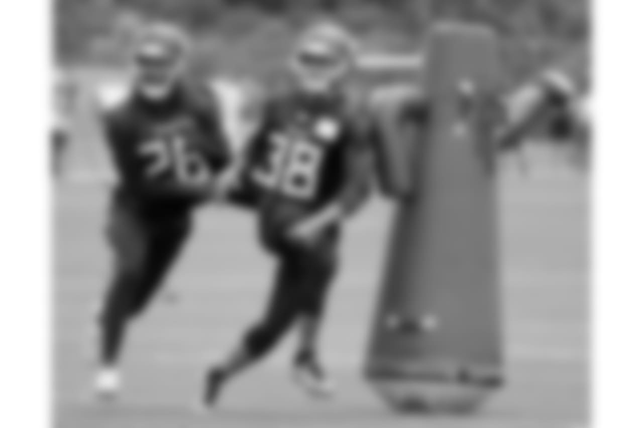 Tennessee Titans defensive back Logan Ryan (26) runs a drill with defensive back Joseph Este (38) during NFL football minicamp Wednesday, June 13, 2018, in Nashville, Tenn. The Titans upgraded their secondary by signing cornerback Malcolm Butler, and safety Kevin Byard is coming off an All-Pro season. Mix in veteran Ryan and Adoree Jackson going into their second seasons together, it's a group with high expectations for the season. (AP Photo/Mark Humphrey)