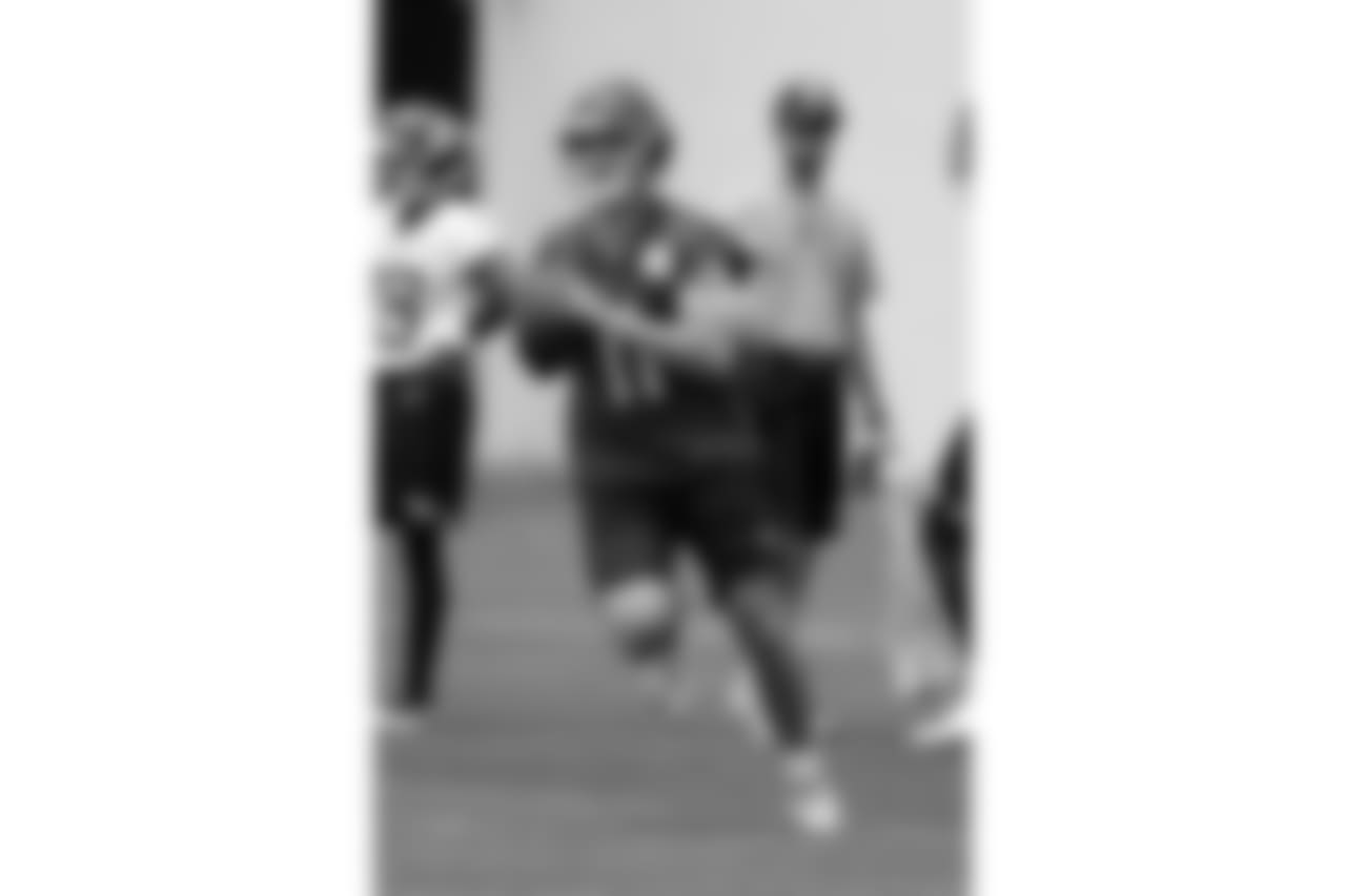 Tennessee Titans quarterback Luke Falk (11) runs a drill during an organized team activity at the Titans' NFL football training facility Wednesday, May 30, 2018, in Nashville, Tenn. (AP Photo/Mark Humphrey)