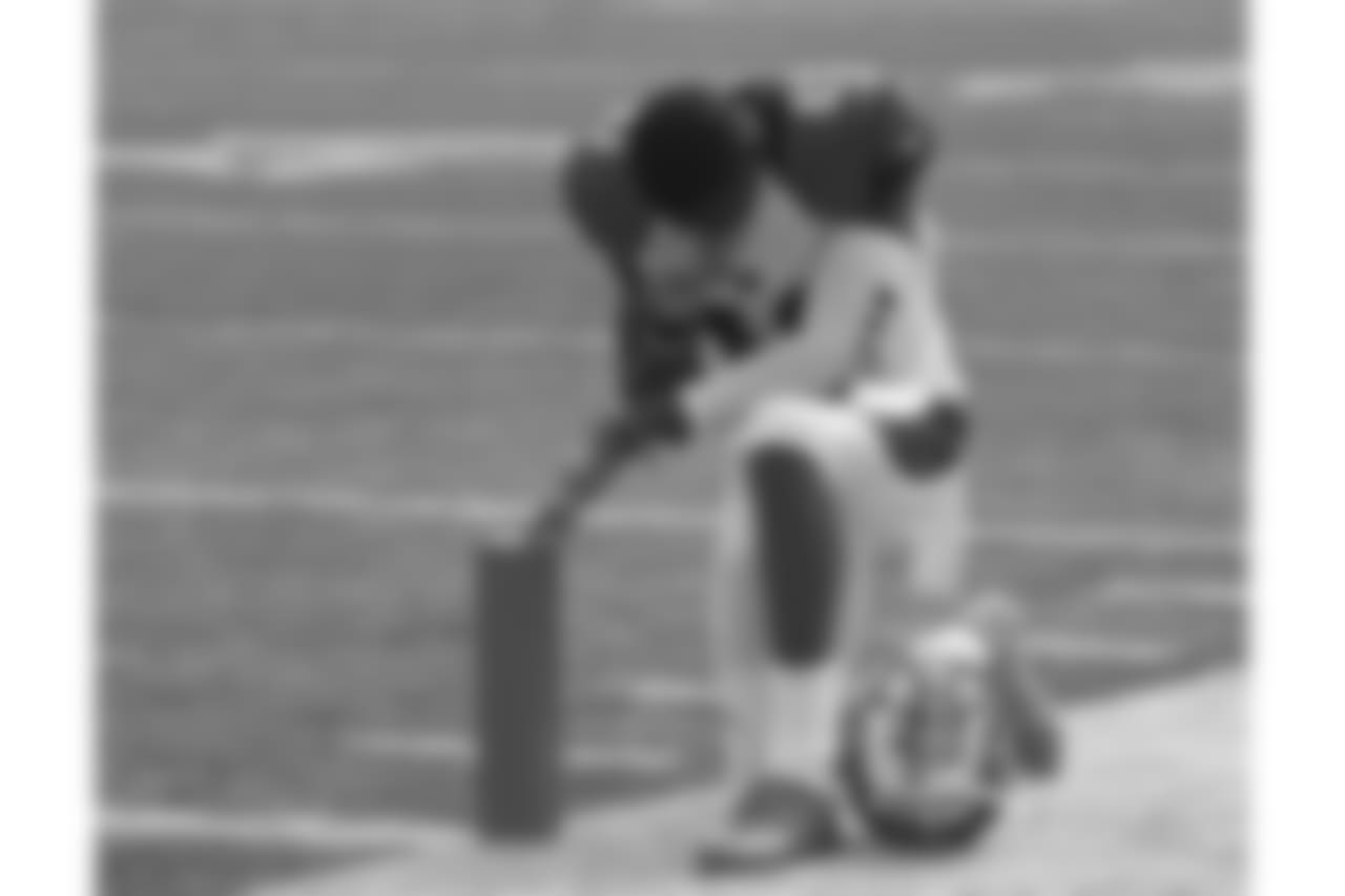 Cincinnati Bengals strong safety George Iloka prays at the start of an NFL football game against the Atlanta Falcons, Sunday, Sept. 14, 2014, in Cincinnati. (AP Photo/Frank Victores)
