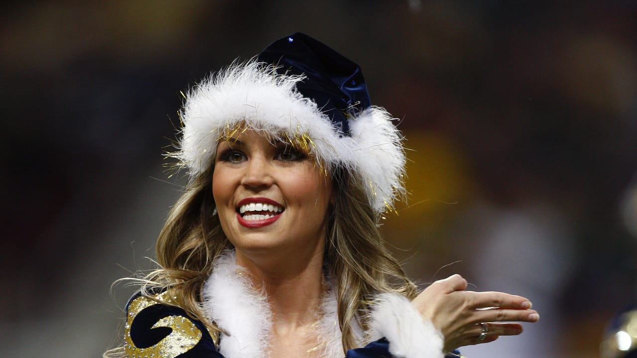 A St. Louis Rams cheerleader entertains the crowds during the Kansas City  Chiefs- St. Louis Rams football game in a Christmas outfit at the Edward  Jones Dome in St. Louis on December