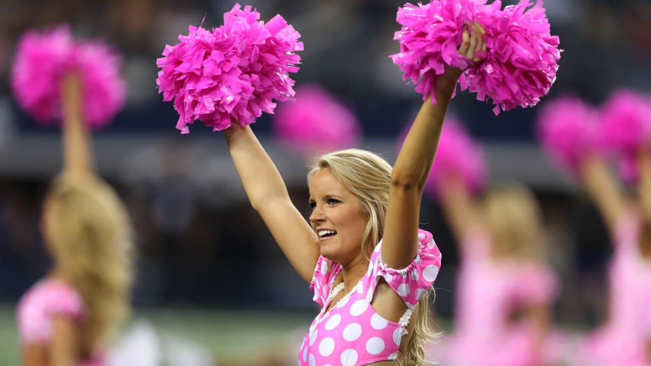 Seattle Seahawks cheerleaders pink pom,poms awareness.