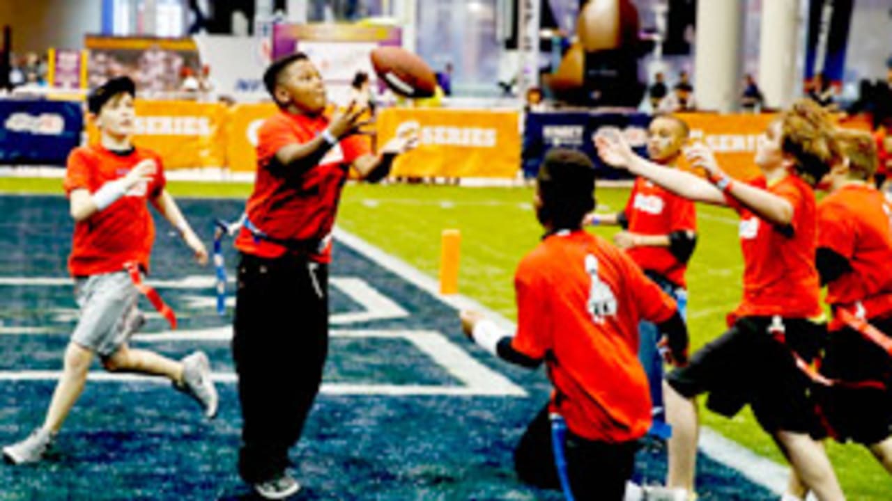 Children involved with Play 60 run onto the field to participate in a game  of flag football during half time of a preseason NFL football game between  the Tampa Bay Buccaneers and