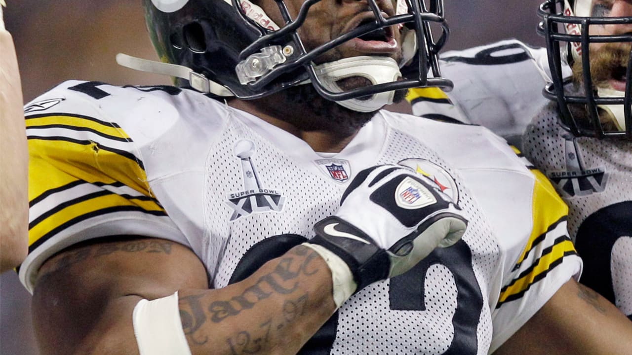 Pittsburgh Steelers linebacker James Harrison (92) runs past Arizona  Cardinals quarterback Kurt Warner returning a pass interception for a 100  yard touchdown against the Arizona Cardinals during the second quarter at  Super