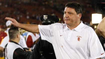Ed Orgeron left USC but stayed in spirit, and he'd love to return now