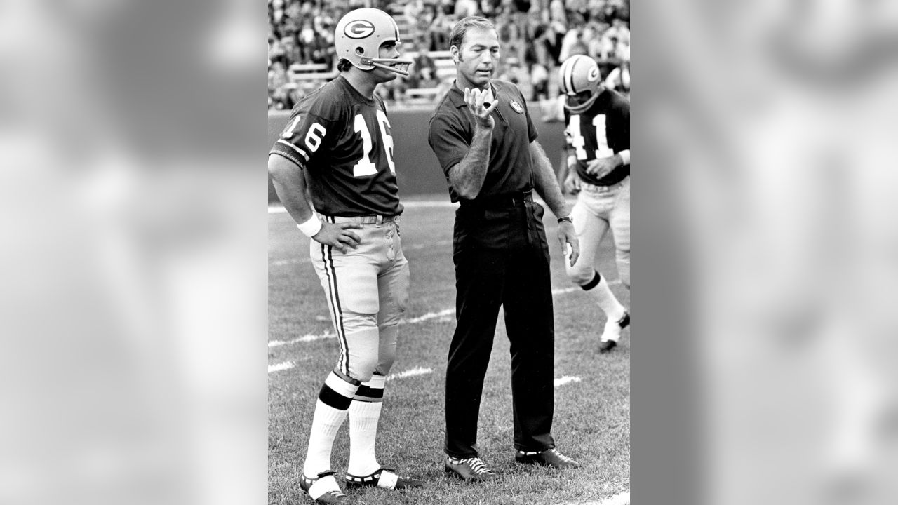 FILE - In this Nov. 12, 1973, file photo, former Green Bay Packers  quarterback Bart Starr accepts jersey No. 15 as the number was retired  during halftime ceremonies of the Green Bay