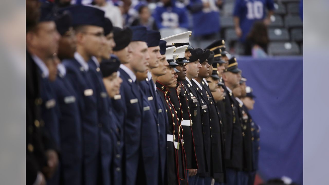 U.S. Military recruits are sworn in during halftime on Salute to Service  military appreciation day at an NFL football game between the Jacksonville  Jaguars and the Las Vegas Raiders, Sunday, Nov. 6