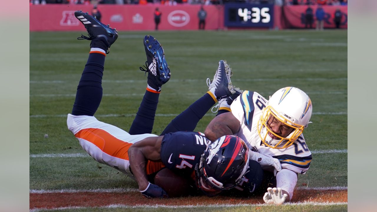 Denver Broncos wide receiver Courtland Sutton (14) is tackled by Detroit  Lions cornerback Dariu …