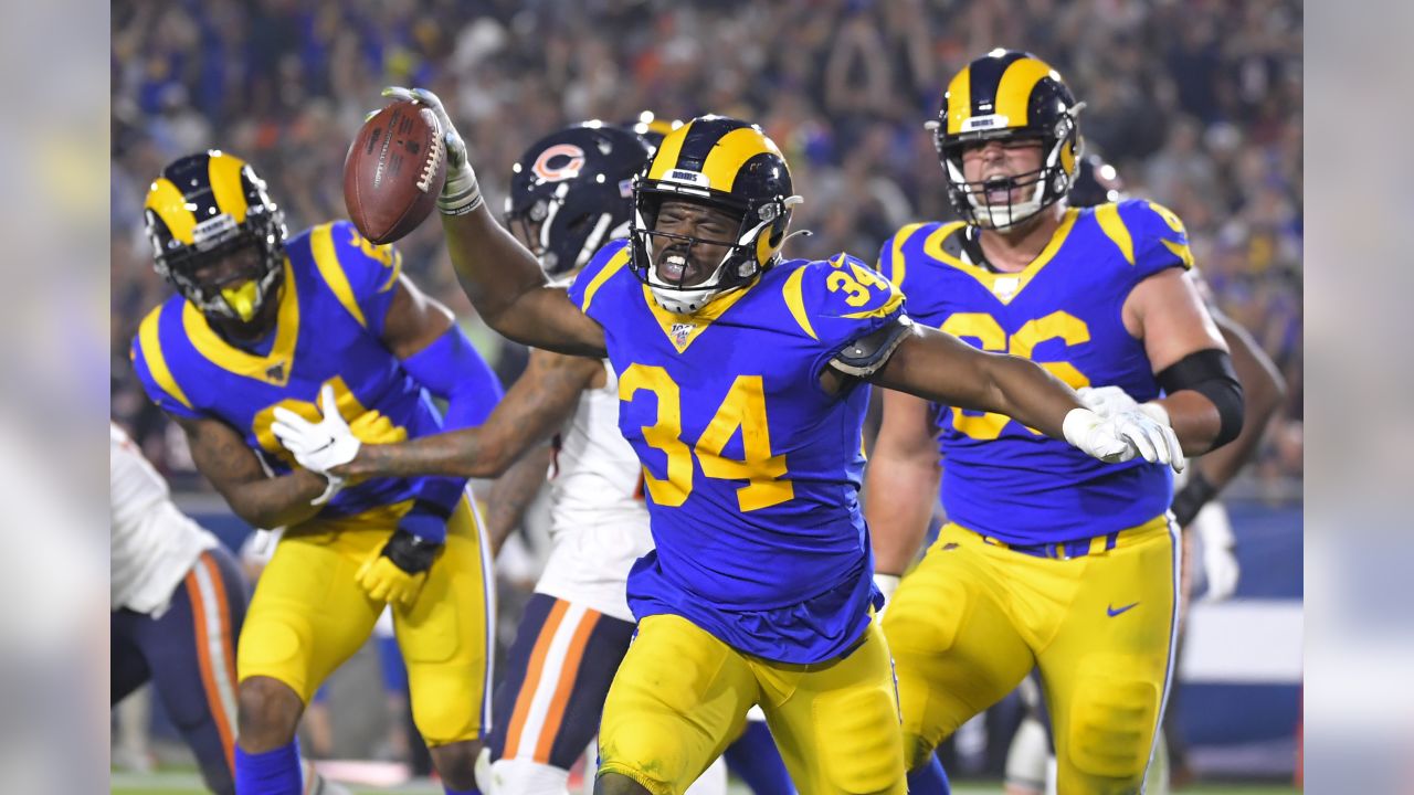 Los Angeles Rams running back Todd Gurley (30) runs for a touchdown against San  Francisco 49ers defensive back Dontae Johnson (36) during the first half of  an NFL football game in Santa