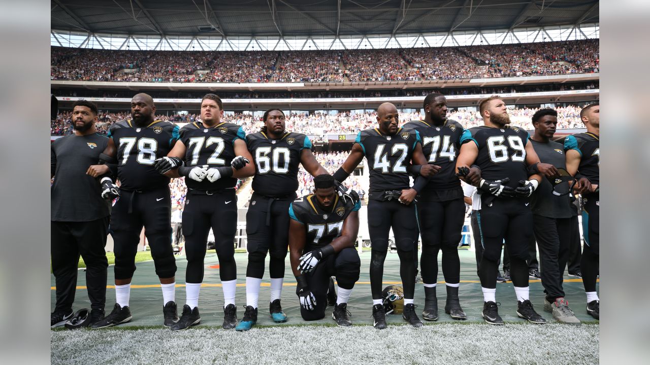 Ravens and Jaguars Players Kneel and Lock Arms During National Anthem