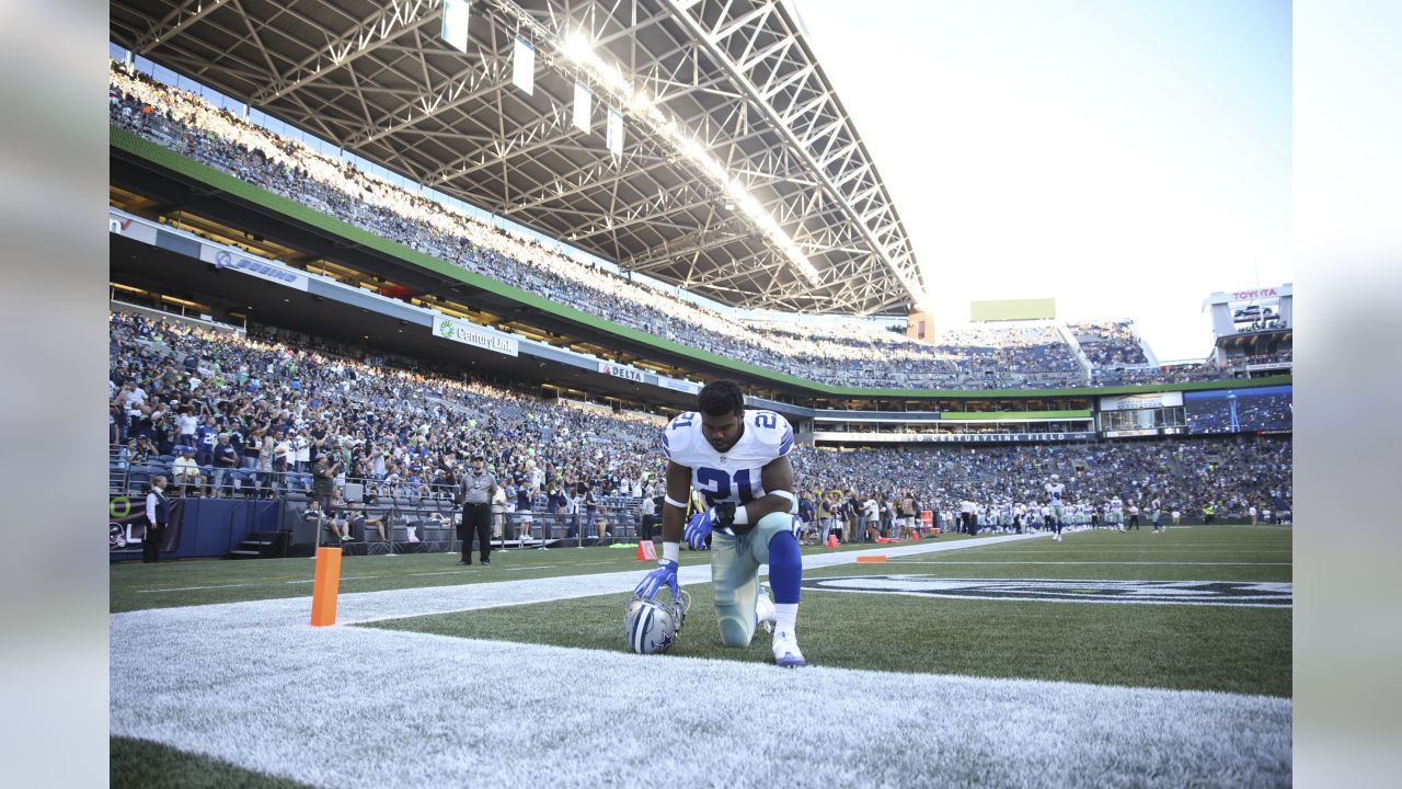 Dallas Cowboys running back Ezekiel Elliott (21) stands on the sideline  during the Pro Football Hall of Fame NFL preseason game against the  Pittsburgh Steelers, Thursday, Aug. 5, 2021, in Canton, Ohio.