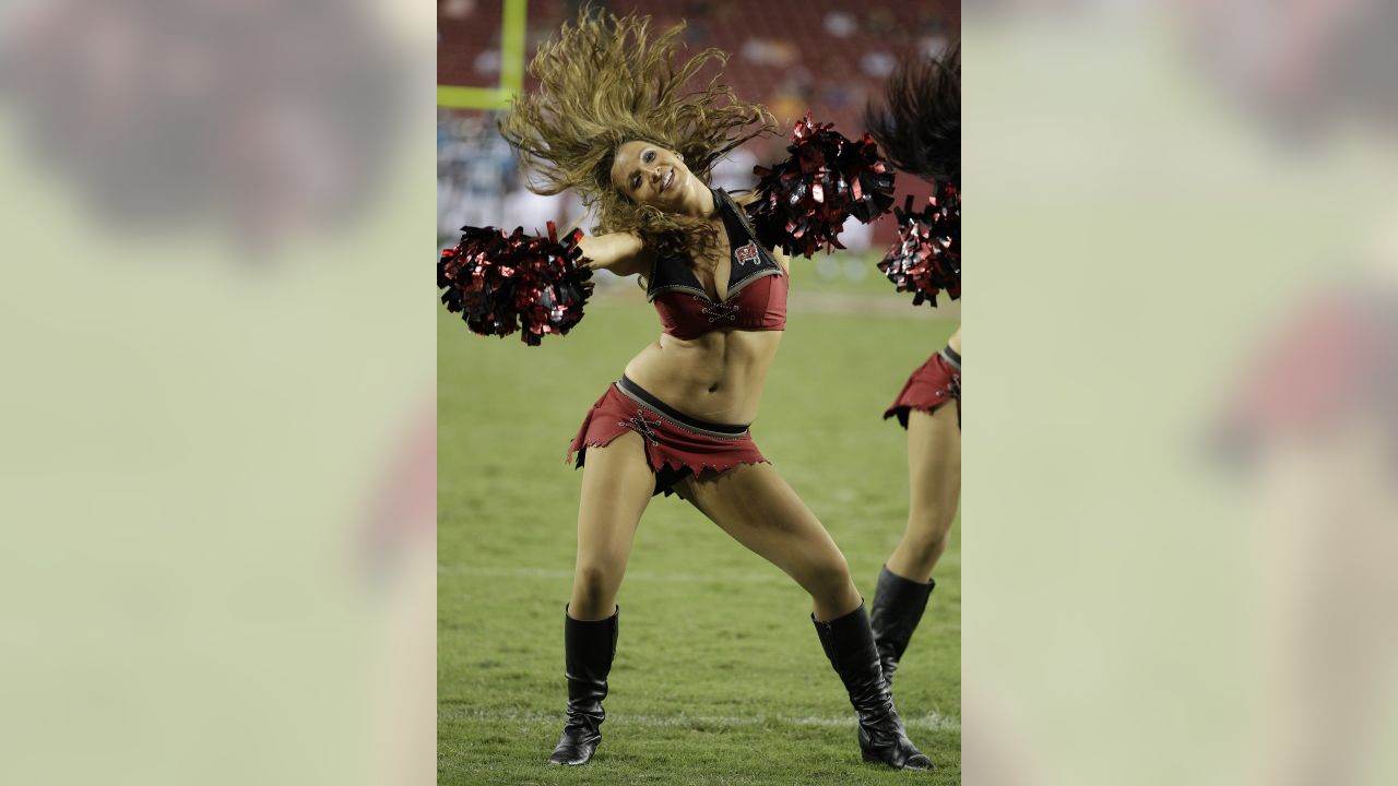 A Washington Commanders cheerleader performs during the first half of an  NFL preseason football game between the Washington Commanders and the  Baltimore Ravens, Monday, Aug. 21, 2023, in Landover, Md. The Commanders