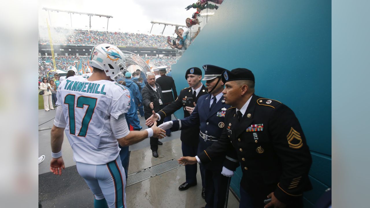 An Indianapolis Colts player warms up by a Salute to Service military  appreciation logo before an NFL football game against the Tennessee Titans  Thursday, Nov. 12, 2020, in Nashville, Tenn. (AP Photo/Ben