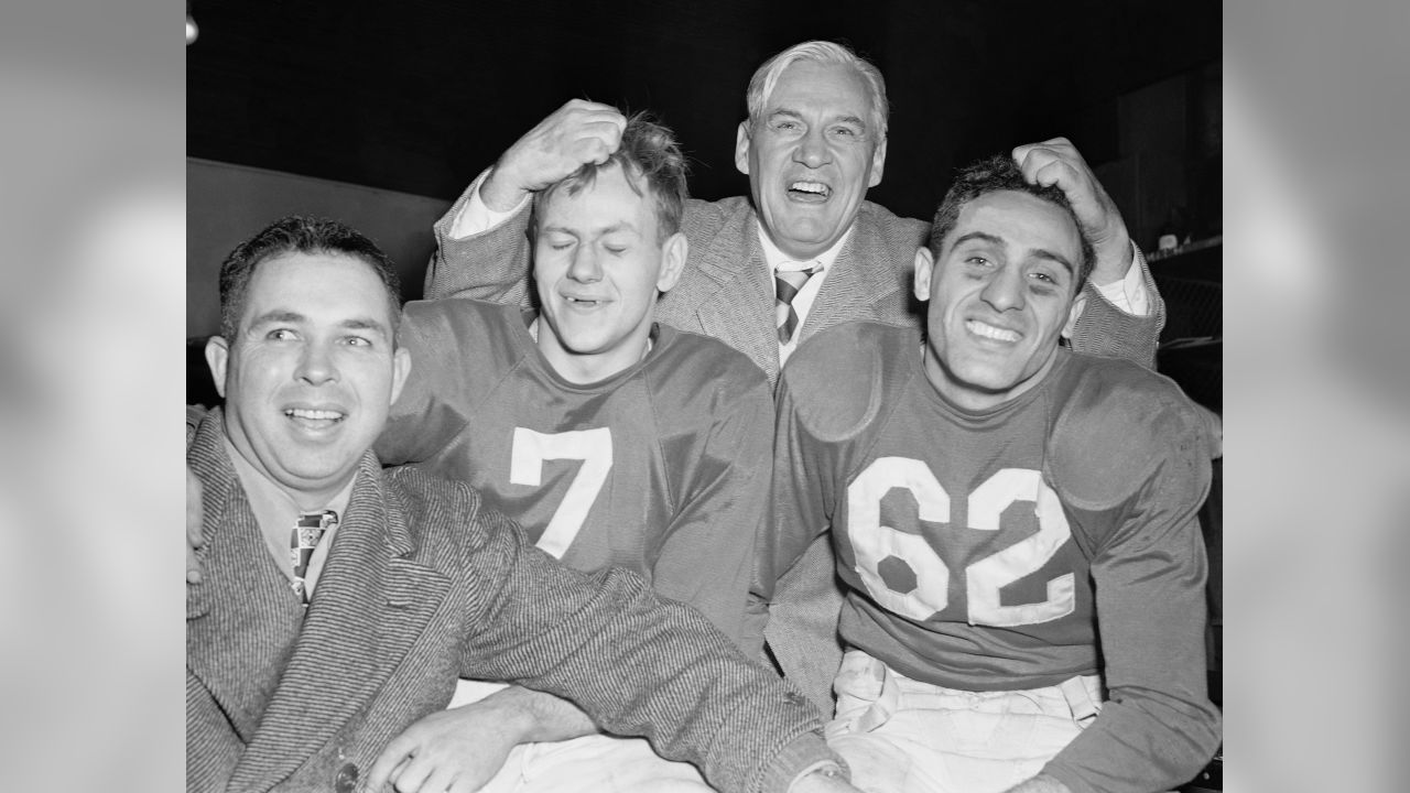 Jimmy Conzelman and Chicago Cardinals football players cheer in