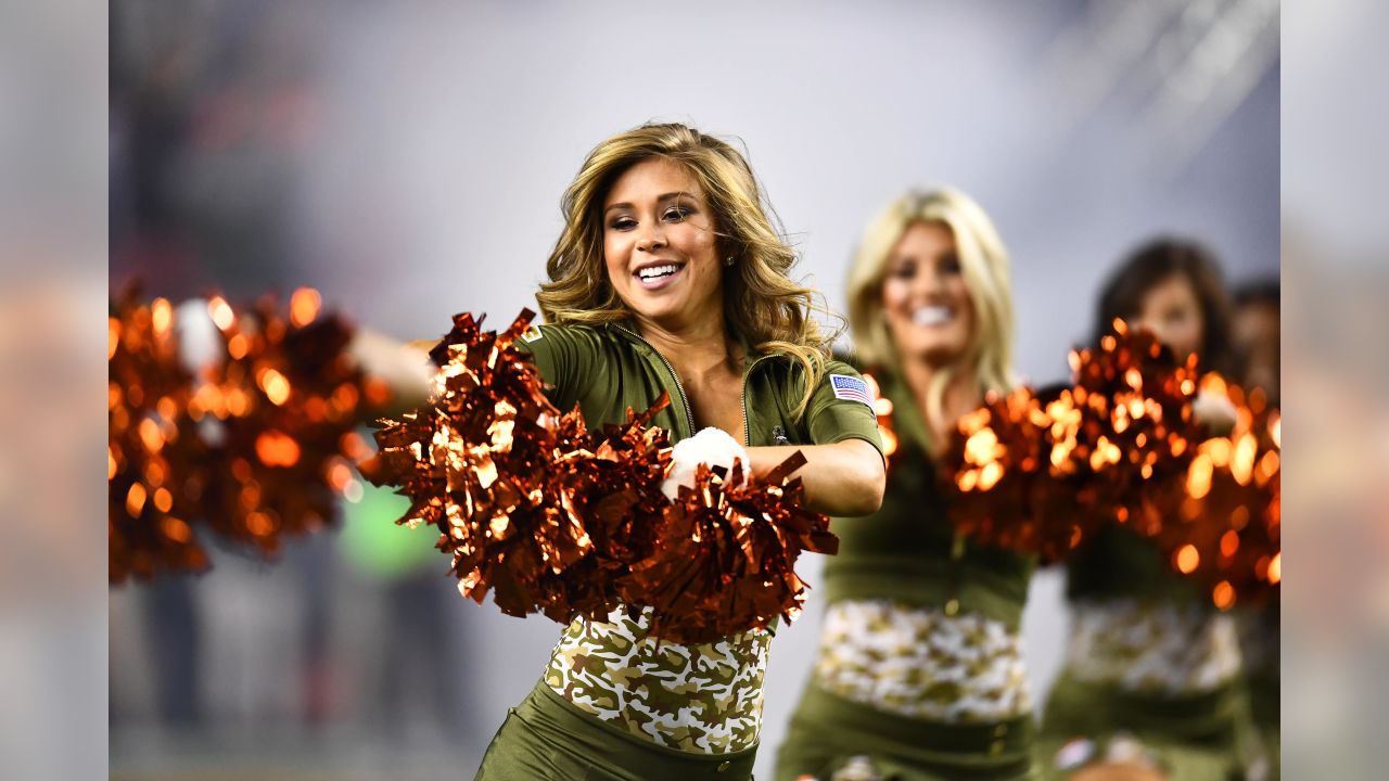 The Denver Broncos cheerleaders wear green to celebrate the NFL's Salute to  Service prior to an NFL football game against the New England Patriots,  Sunday, Nov. 12, 2017, in Denver. (AP Photo/David