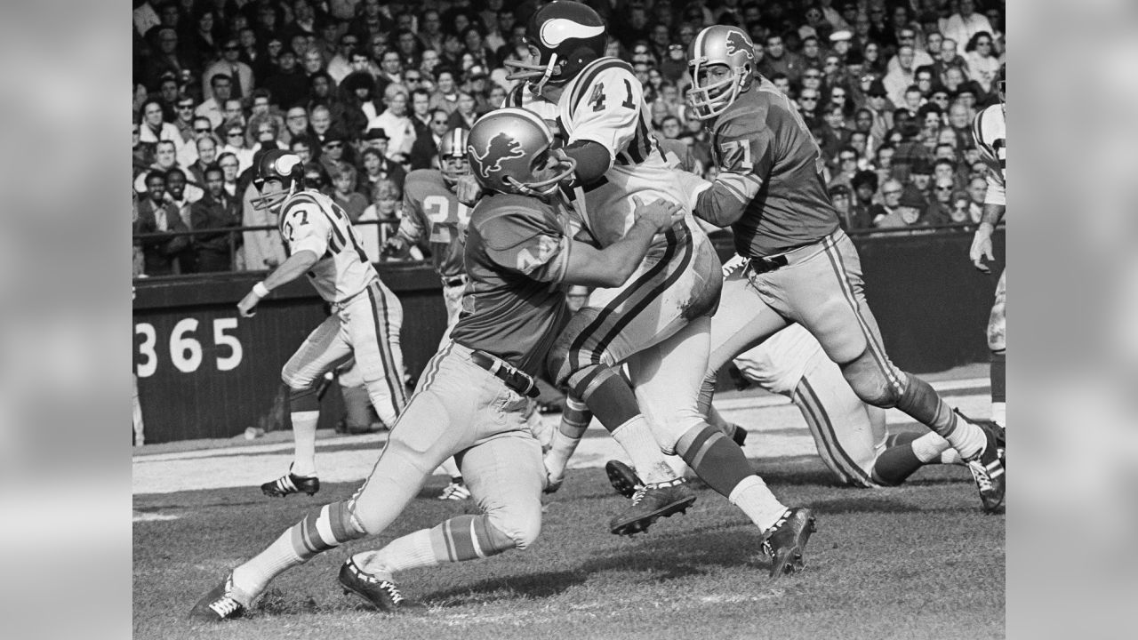 Baltimore Colts end Raymond Berry snags a pass from quarterback John Unitas  for a five-yard gain as the Colts and the Detroit Lions tangled, Sept. 30,  1962 in Baltimore, Md. Defensive halfback