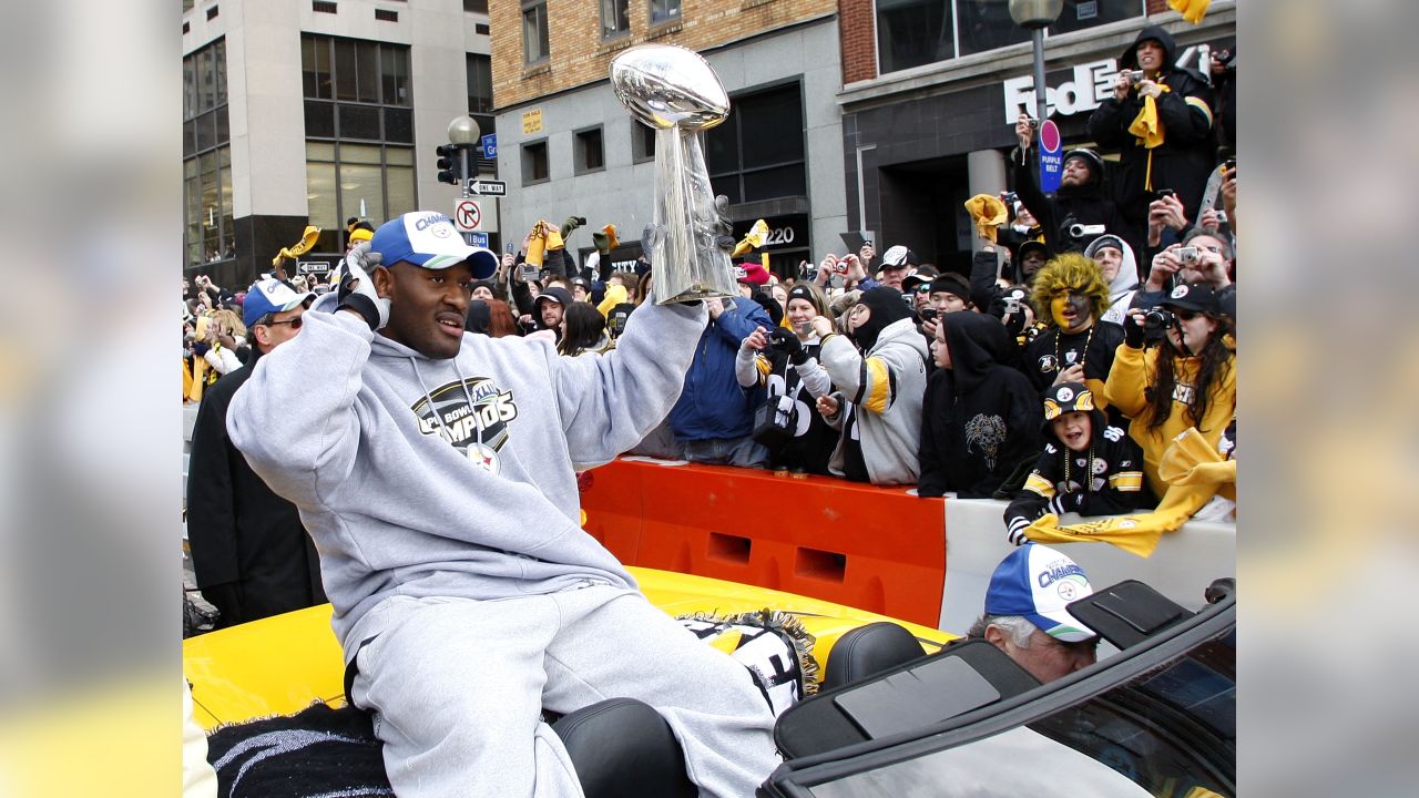 Pittsburgh Steelers James Harrison polishes the Vince Lombardi Trophy  during the victory parade for the winners of Super Bowl XLIII in  Pittsburgh, on February 3, 2009. The Steelers defeated the Arizona Cardinals