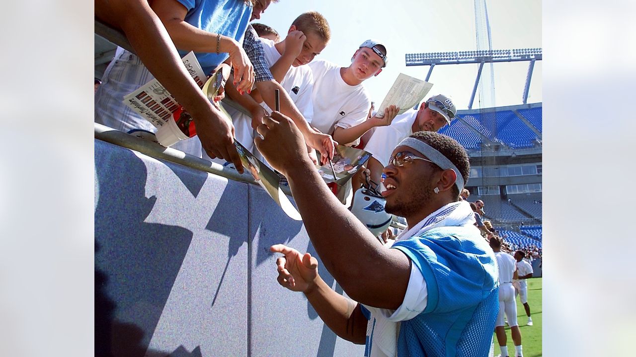 Carolina Panthers coach John Fox, left, helps draft choice Julius Peppers  of North Carolina hold up a jersey during a news conference in Charlotte,  N.C., Saturday, April 20, 2002, after Peppers was