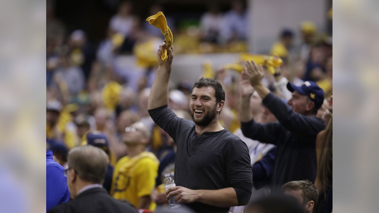 NFL players and coaches take in the NBA