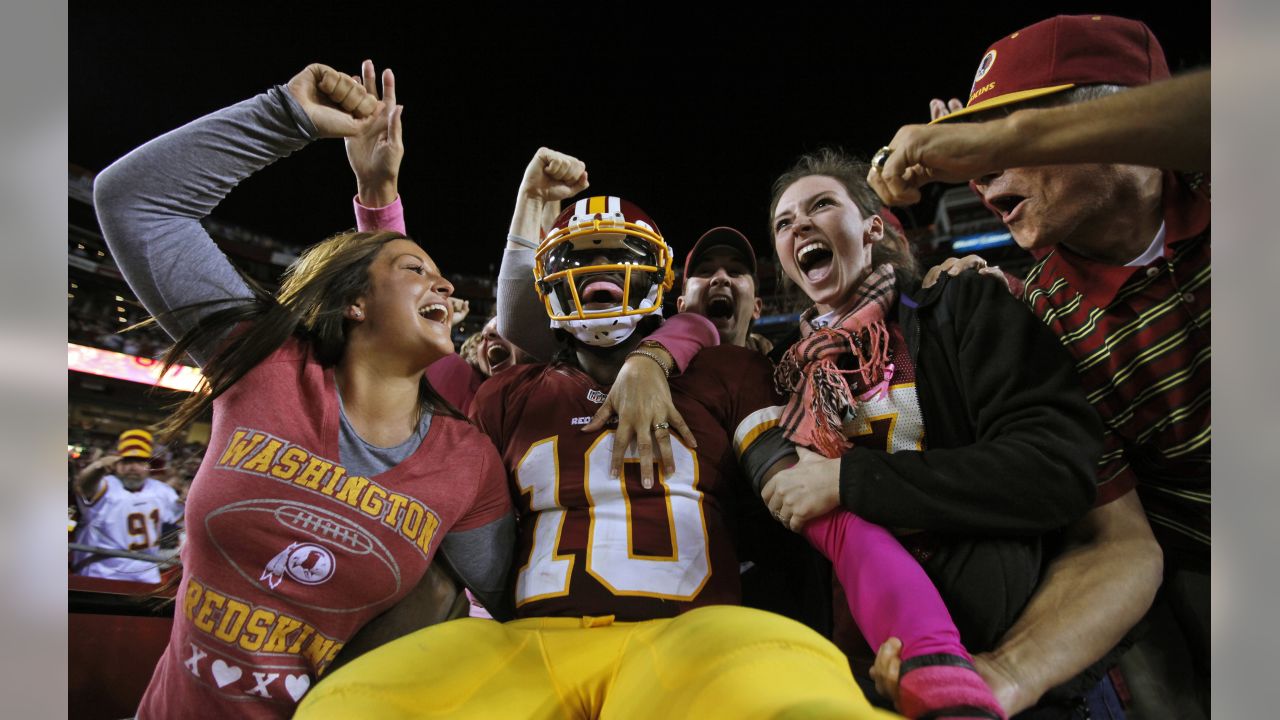 Redskins quarterback Robert Griffin III shows fans at draft party