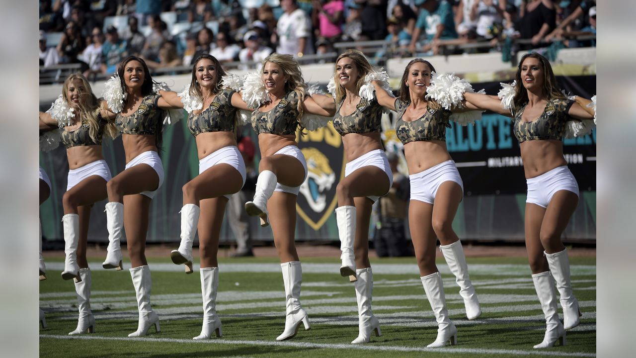 The Dallas Cowboys Cheerleaders perform during an NFL football game against  the Miami Dol…