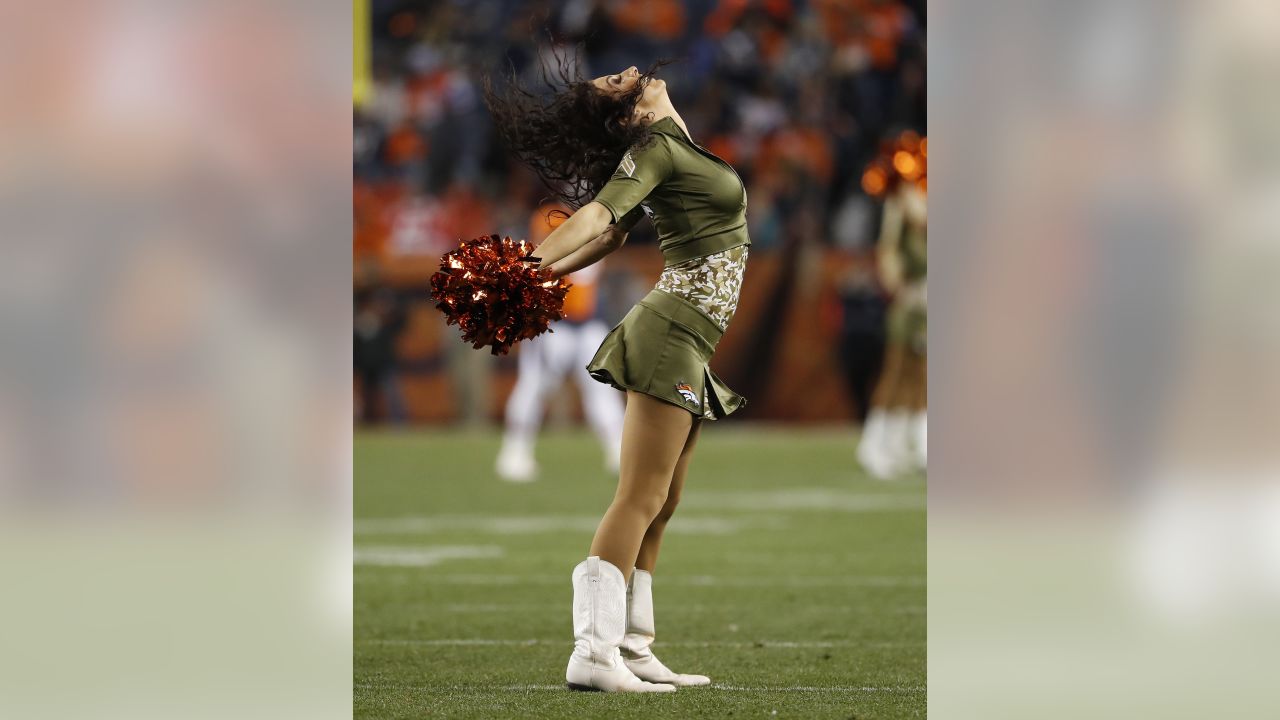 The Denver Broncos cheerleaders wear green to celebrate the NFL's Salute to  Service prior to an NFL football game against the New England Patriots,  Sunday, Nov. 12, 2017, in Denver. (AP Photo/David