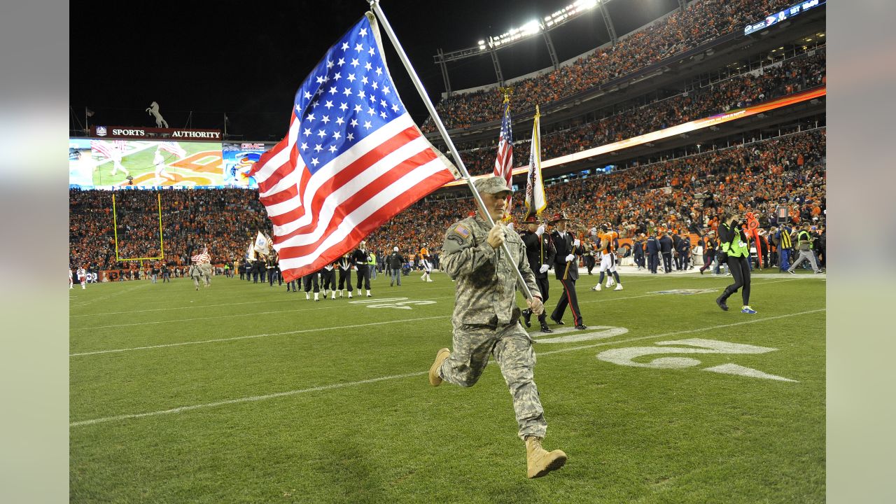 The American Flag and the Salute to Service logo is shown on a hoodie  before an NFL football game between the Indianapolis Colts and the Las  Vegas Raiders in Las Vegas, Sunday